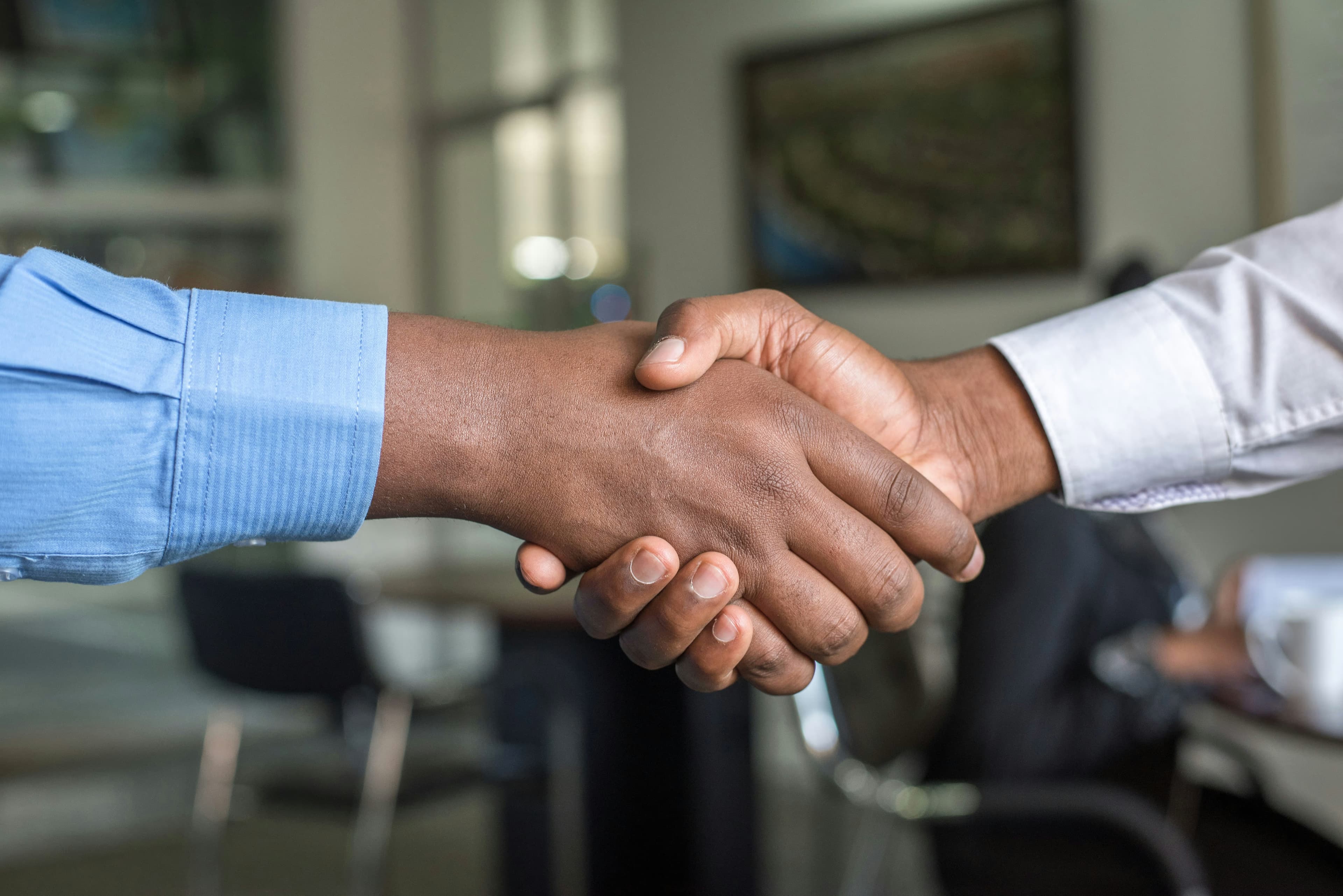 Real estate deal handshake partnership